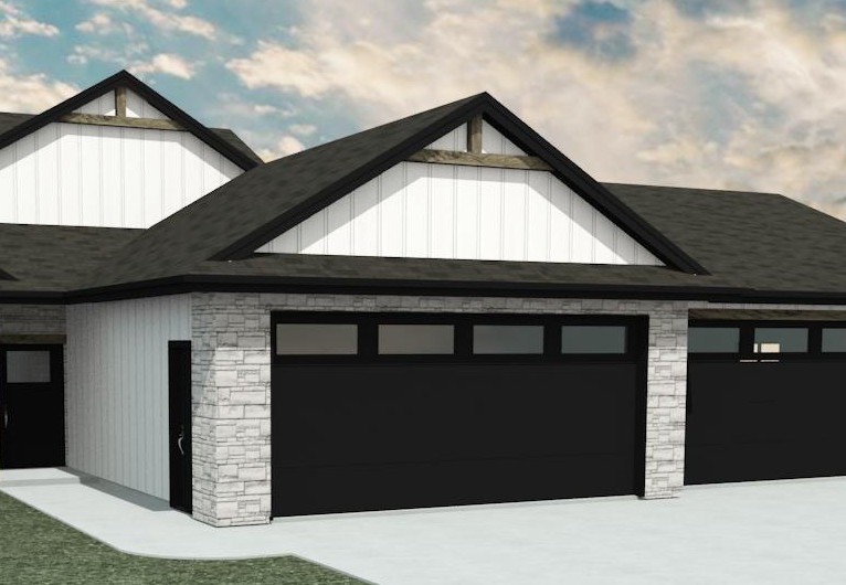 Three car garage and stone entry detail on the upcoming Claremont custom home